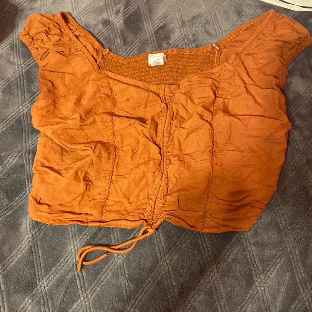 I am selling a brown crop top size Large worn 3 times.